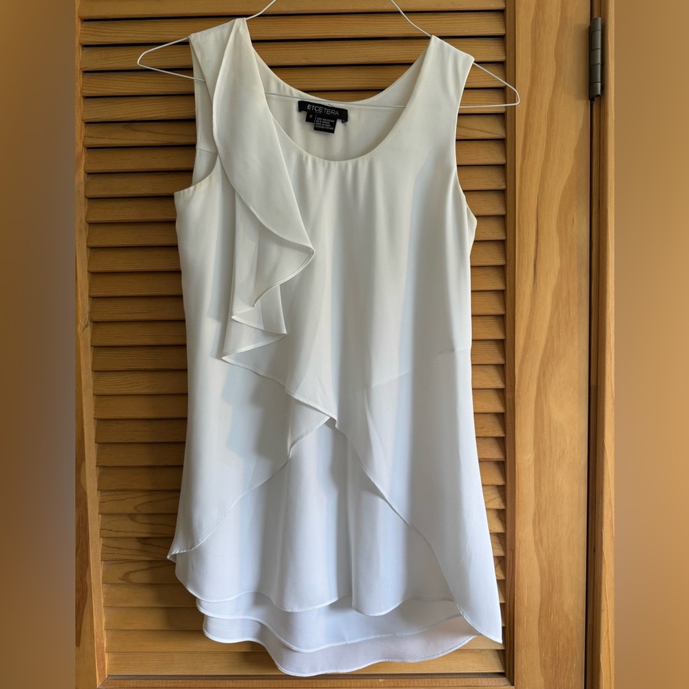 White ruffle sleveless top